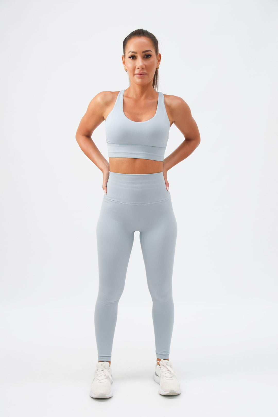 Woman wearing Hermosa Athletica high waisted ribbed leggings in the gym